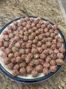 This is a picture of the tiny uncooked meatballs. 